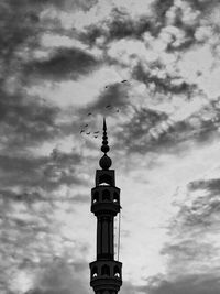 Low angle view of bell tower against sky