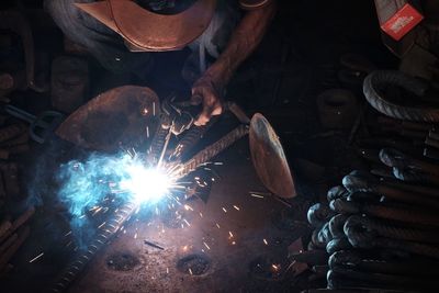 Man working on metal in factory