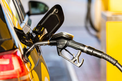 Close-up of yellow wheel in car