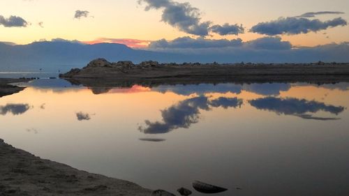 Scenic view of lake against sky during sunset