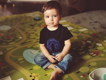 Cute boy sitting at home