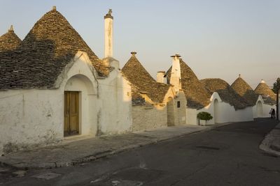 Sunset view of a street in alberobello, italy
