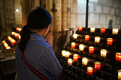 Woman praying in church