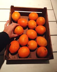 High angle view of oranges in container