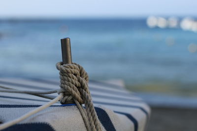Close-up of rope tied on boat at sea