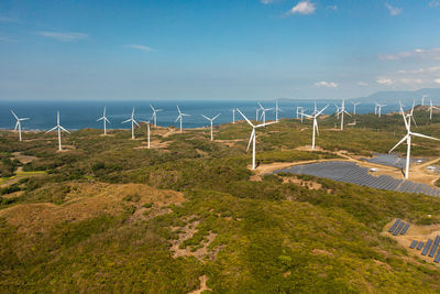 Wind turbine power generators at sea coastline. alternative renewable energy. philippines.