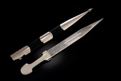 Close-up of nails on black background