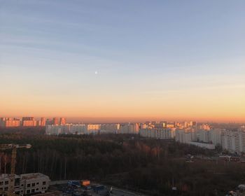 High angle view of buildings against sky during sunset