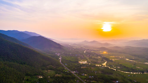 Scenic view of mountains against sky during sunset