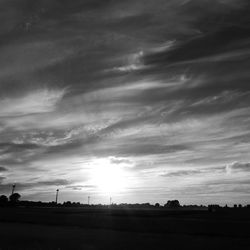 Scenic view of silhouette field against sky at night