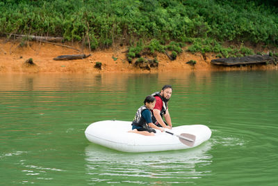 Men on boat in lake