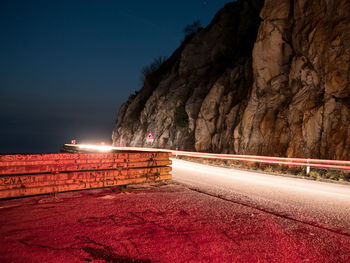 Road against sky at night