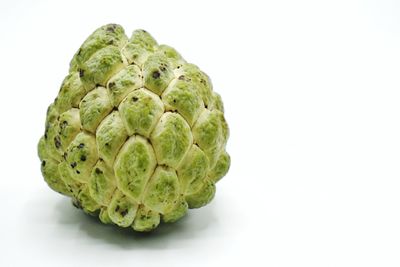 Close-up of strawberry over white background