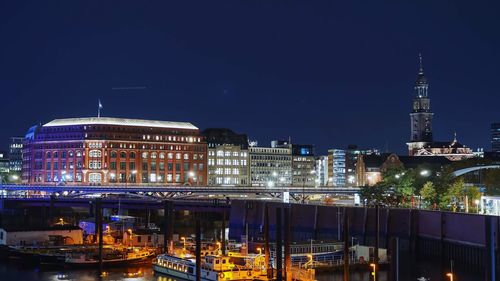 Illuminated buildings in city at night