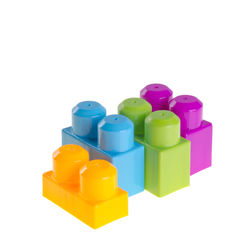 Close-up of multi colored toy over white background