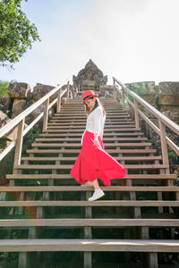 Red umbrella on staircase