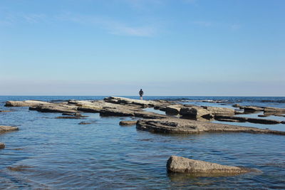 Scenic view of sea against blue sky