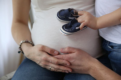 Midsection of woman holding hands