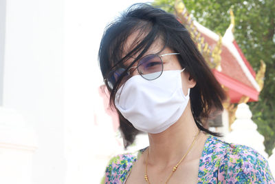 Portrait of young woman wearing sunglasses