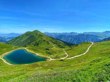 Scenic view of mountains against clear blue sky