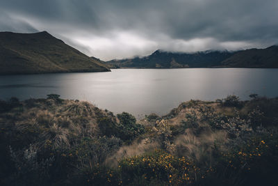 Scenic view of lake and mountains against sky