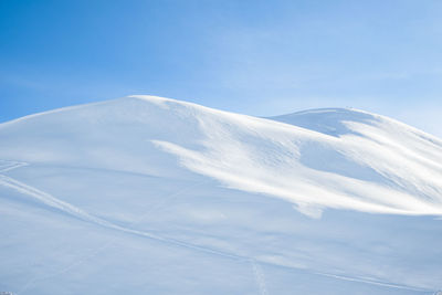 Low angle view of snowcapped mountain against sky in micigliano, lazio italy 