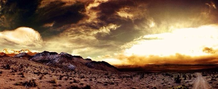 Scenic view of landscape against cloudy sky