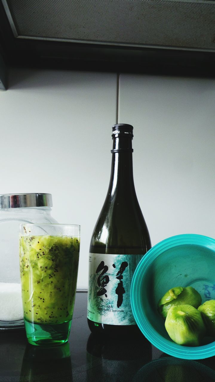 food and drink, indoors, freshness, still life, drink, table, refreshment, drinking glass, glass - material, close-up, food, healthy eating, transparent, no people, glass, bottle, drinking straw, lemon, green color, window