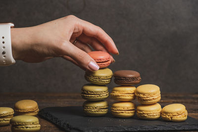 Human hand holding stack of objects