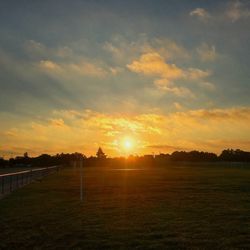 Scenic view of landscape at sunset