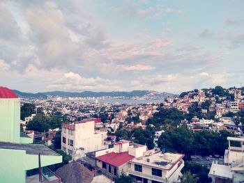 High angle shot of cityscape against sky