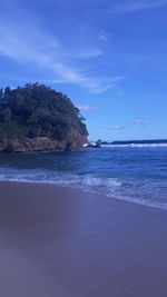 Scenic view of sea against blue sky