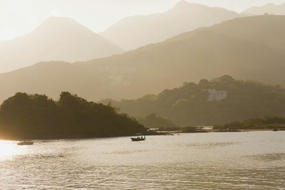 Scenic view of sea with mountains in background