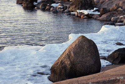 Rocks in sea during winter