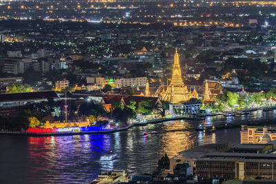 Illuminated buildings in city at night