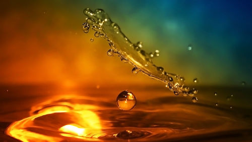 Close-up of water splashing against blurred background