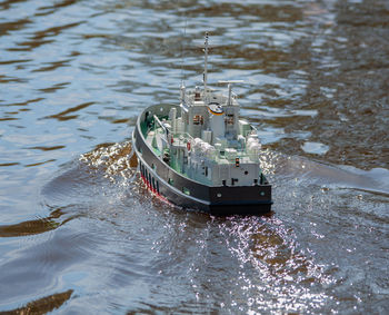 Remote controlled ship model is remote controlled on a lake