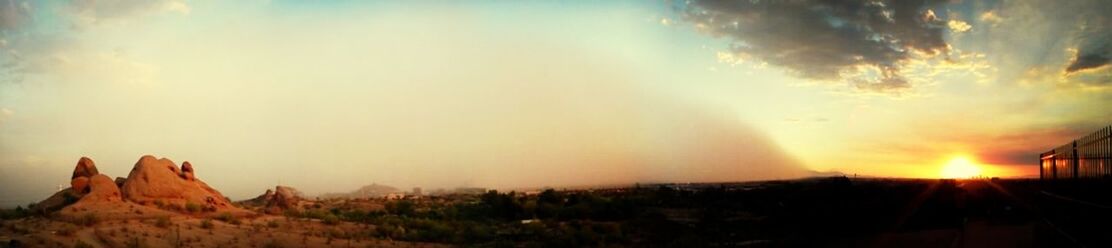 Scenic view of landscape against sky during sunset