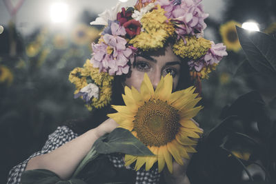 Close-up portrait of woman with flowers