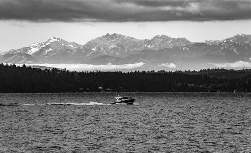 A view of the olympic mountains across elliot bay in seattle, washington.