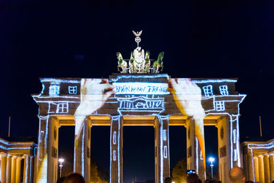 Low angle view of statue at night