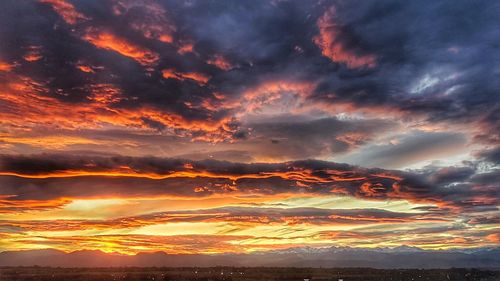 Low angle view of dramatic sky during sunset