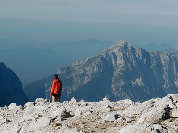 Rear view of man standing on mountain