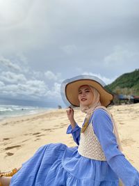Potrait of women sitting on the beach - nunggalan, bali, indonesia 16 april 2021 