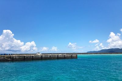 Scenic view of sea against blue sky