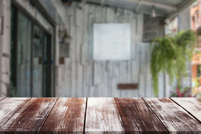 Close-up of empty wooden table in building