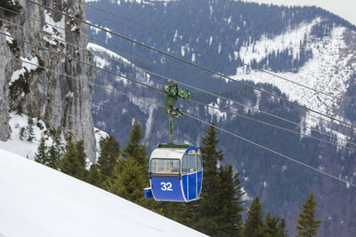 Blue gondola at kampenwand in bavaria, germany, wintertime