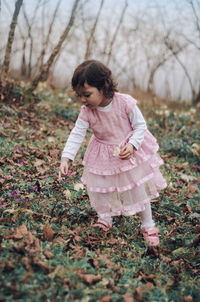 Girl standing on grass