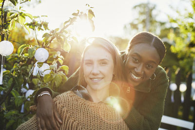 Female friends looking at camera