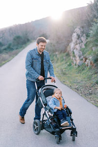 Portrait of man standing on road